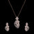 a rose gold-plated cubic zirconia pendant and earring set.