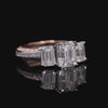Elegant Three-Stone Emerald Cut Diamond Ring with Pavé Band in Two-Tone Gold